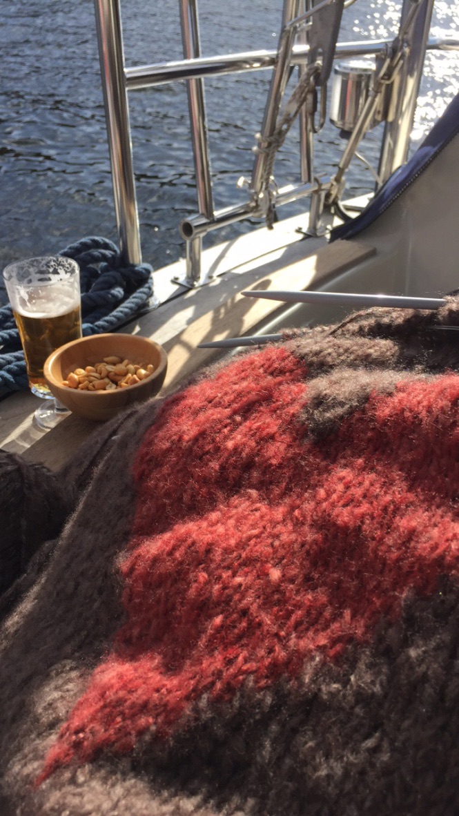 Enjoying the sun beer knitting